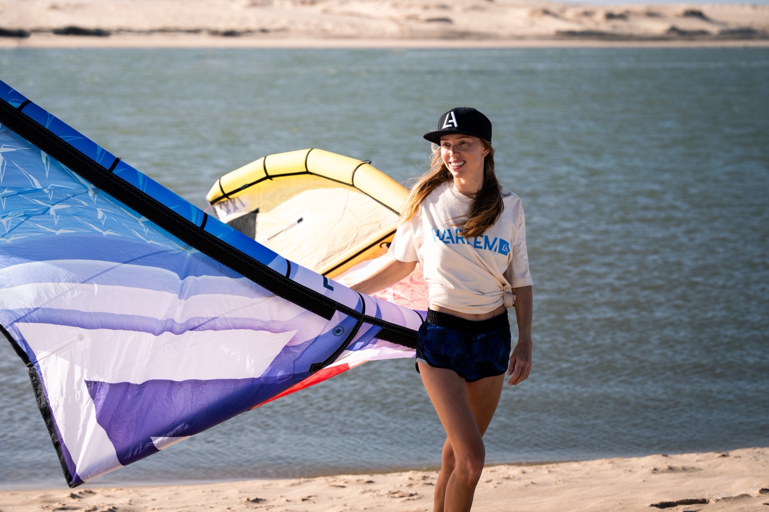Wide view of Le Morne kite spot with riders on the water